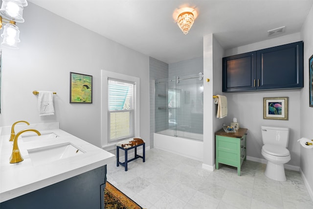 full bathroom featuring vanity, toilet, and bath / shower combo with glass door