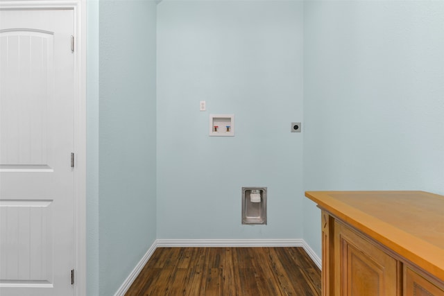 laundry room featuring dark hardwood / wood-style flooring, cabinets, hookup for a washing machine, and hookup for an electric dryer