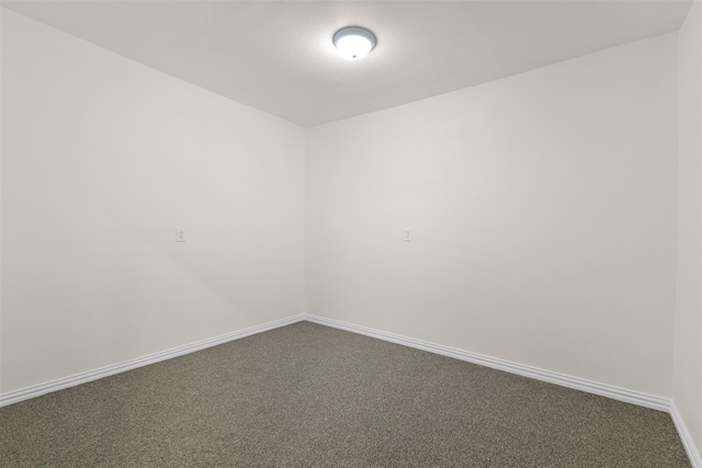 spare room featuring carpet floors