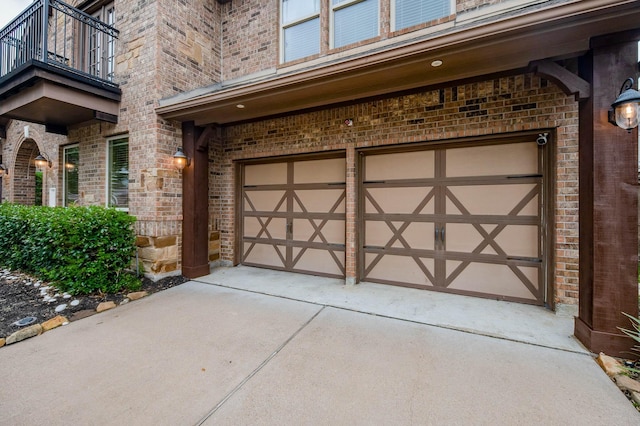 garage with concrete driveway