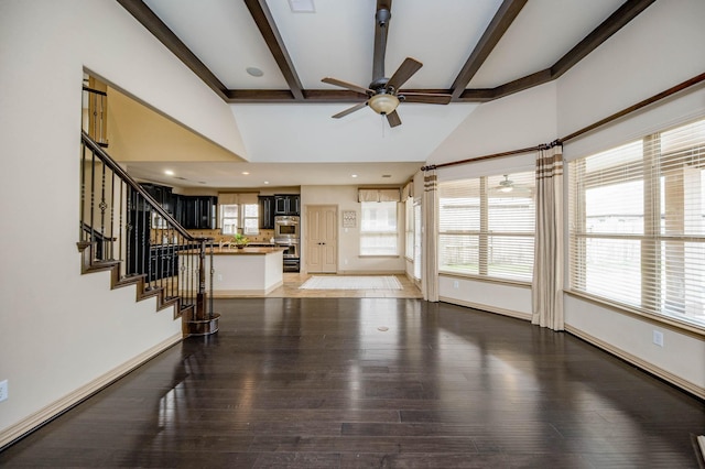 unfurnished living room with light wood finished floors, stairway, a ceiling fan, and baseboards