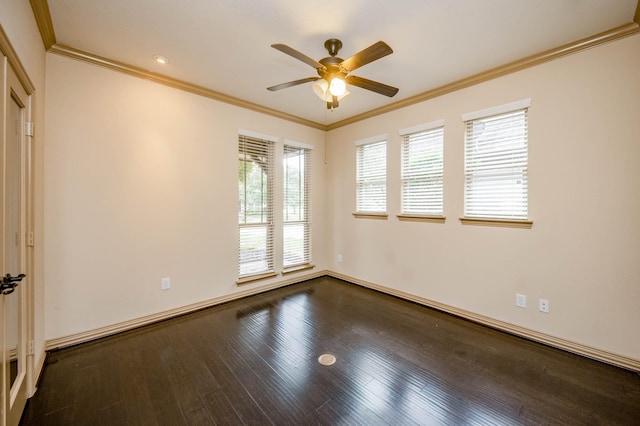 empty room with a ceiling fan, baseboards, ornamental molding, and wood finished floors