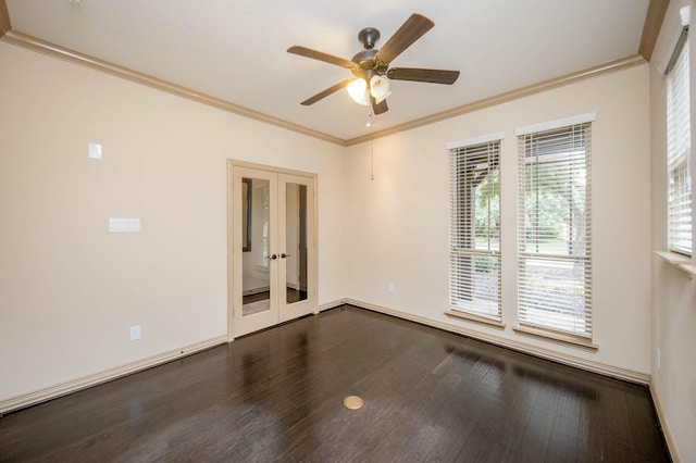 spare room featuring dark wood-style floors, french doors, crown molding, a ceiling fan, and baseboards