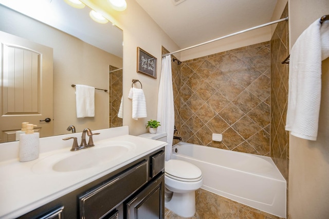 bathroom featuring vanity, shower / bath combination with curtain, and toilet