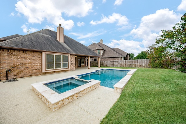 view of swimming pool with a patio area, a fenced backyard, a pool with connected hot tub, and a lawn