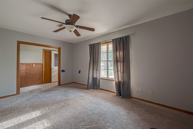 carpeted empty room with ceiling fan