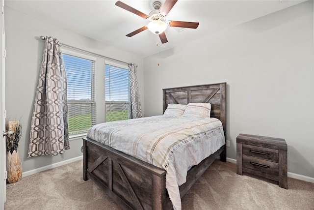 bedroom with light carpet and ceiling fan