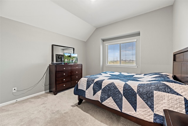 carpeted bedroom featuring vaulted ceiling