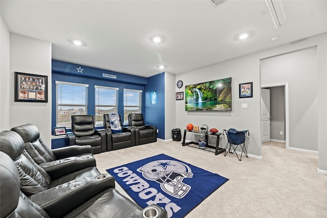 cinema room featuring carpet floors