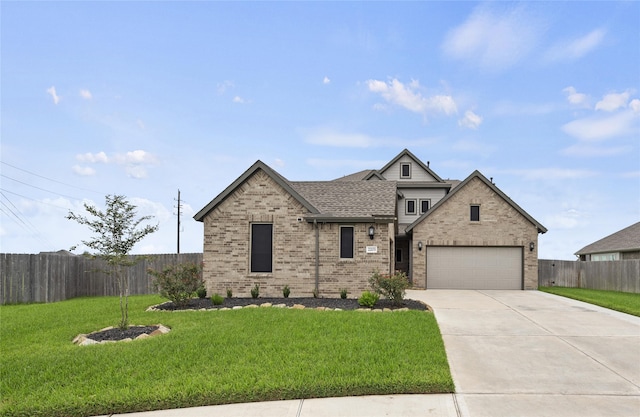 view of front of house featuring a front lawn and a garage