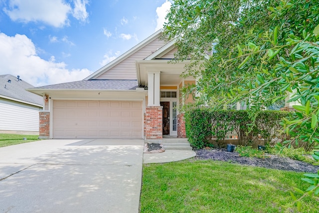 view of front of home with a garage and a front lawn