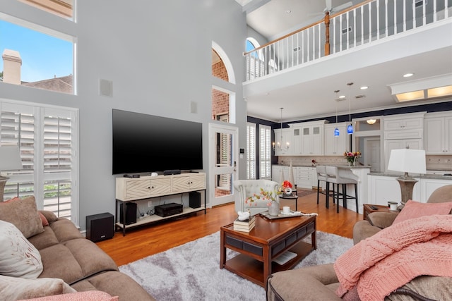 living room featuring a wealth of natural light and a high ceiling