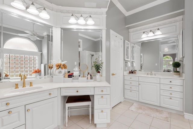 bathroom featuring crown molding, vanity, and a wealth of natural light