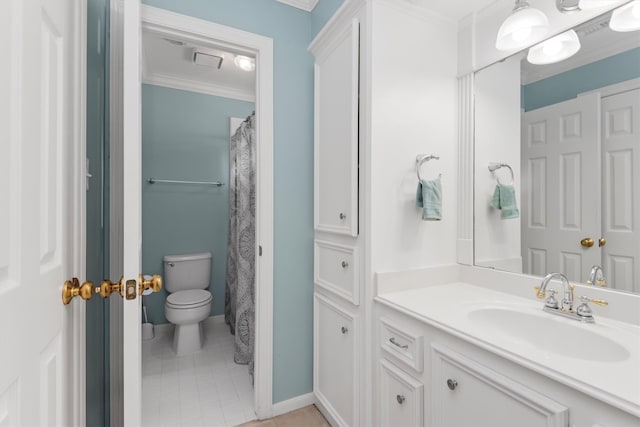 bathroom with crown molding, vanity, toilet, and tile patterned flooring