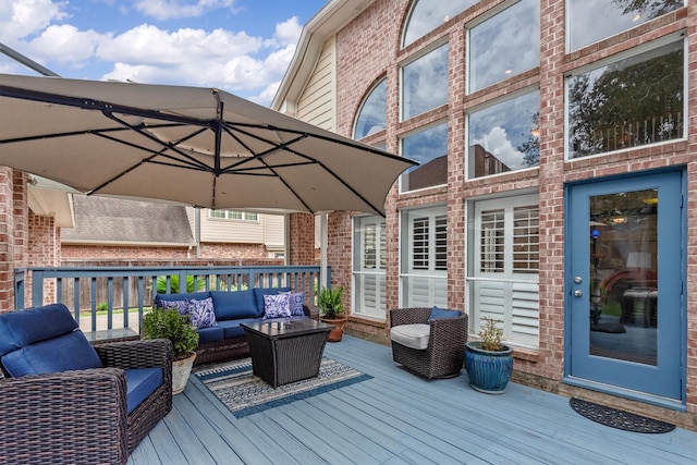 wooden terrace featuring an outdoor hangout area