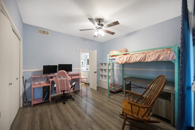 office space featuring dark wood-type flooring and ceiling fan