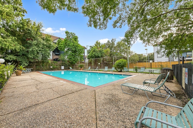 view of swimming pool featuring a patio area