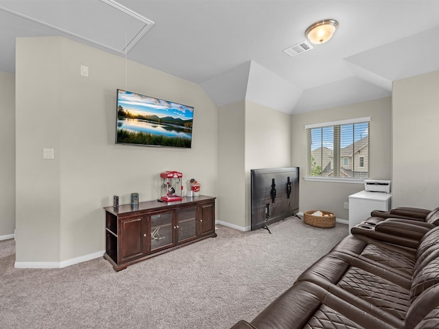 carpeted living room featuring lofted ceiling