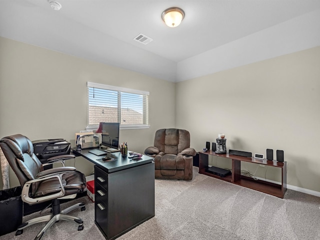 carpeted office featuring vaulted ceiling