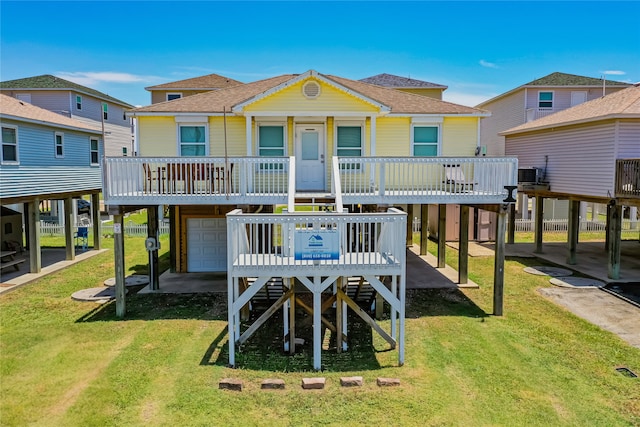 back of house with central AC, a garage, a lawn, and a deck