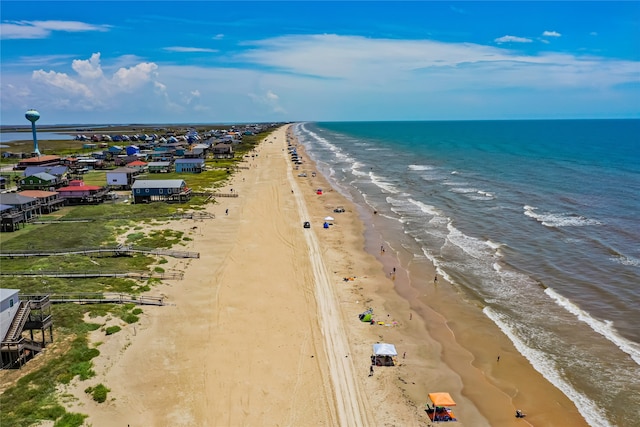 aerial view with a water view and a beach view