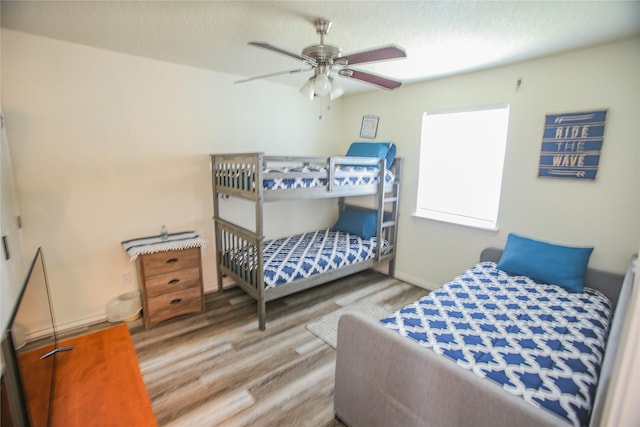 bedroom featuring hardwood / wood-style flooring and ceiling fan