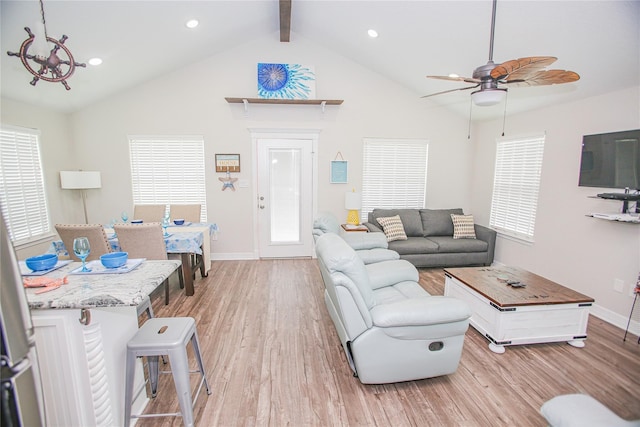 living room featuring high vaulted ceiling, light hardwood / wood-style flooring, beamed ceiling, and ceiling fan