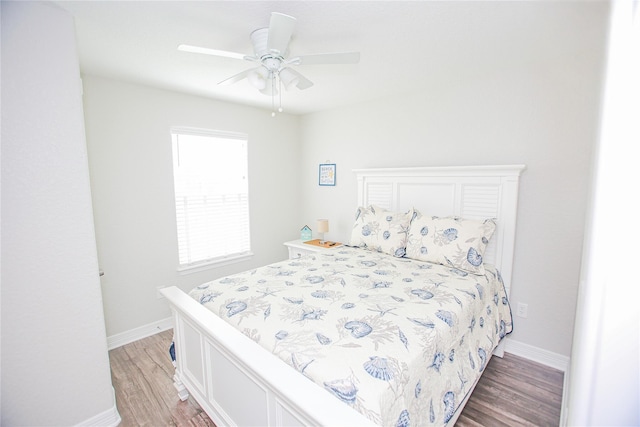 bedroom featuring hardwood / wood-style floors and ceiling fan