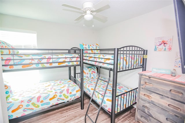 bedroom featuring hardwood / wood-style floors and ceiling fan