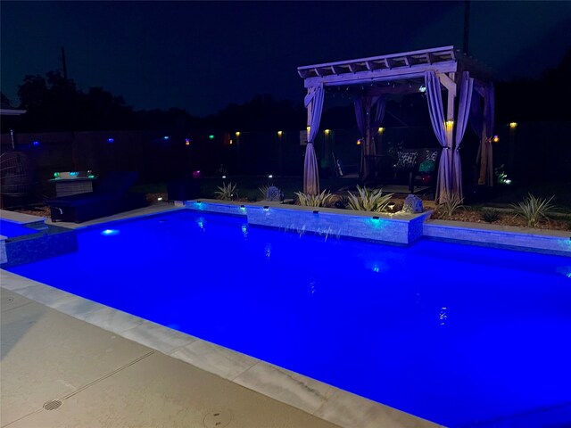 pool at twilight featuring a pergola