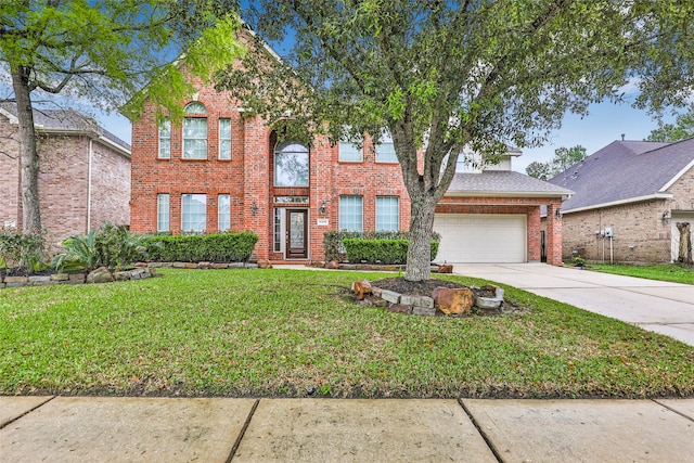 view of front of house featuring a garage and a front lawn