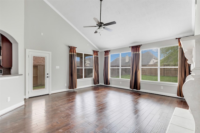 unfurnished living room featuring high vaulted ceiling, ceiling fan, dark hardwood / wood-style floors, and ornamental molding