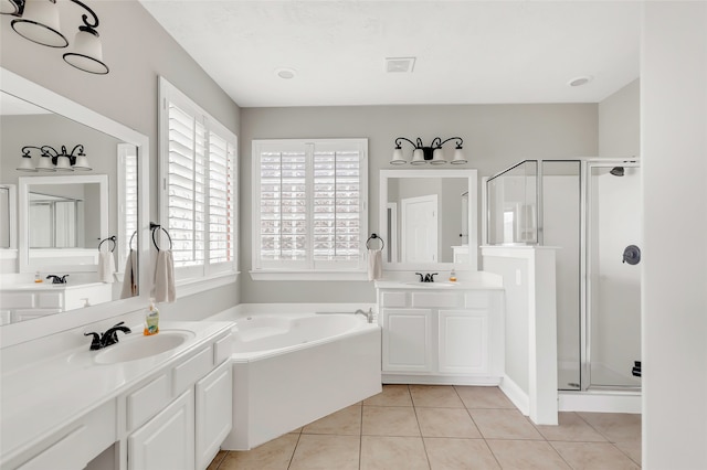 bathroom with shower with separate bathtub, vanity, and tile patterned floors