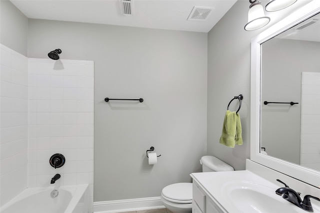 full bathroom with toilet, tiled shower / bath combo, and vanity