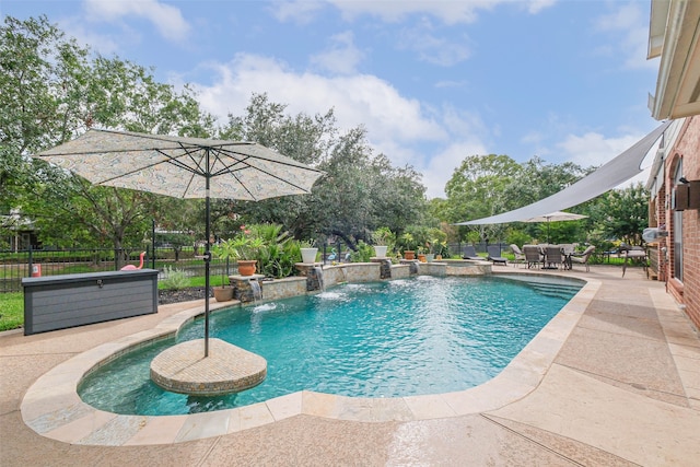 view of pool with a patio area and pool water feature