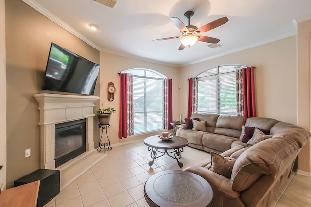 tiled living room with crown molding and ceiling fan