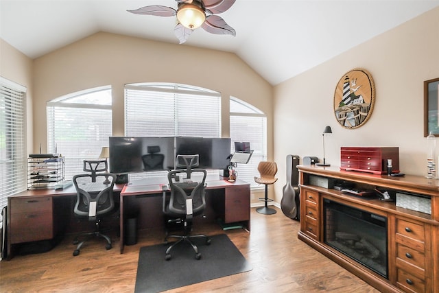 office space featuring lofted ceiling, wood-type flooring, and ceiling fan