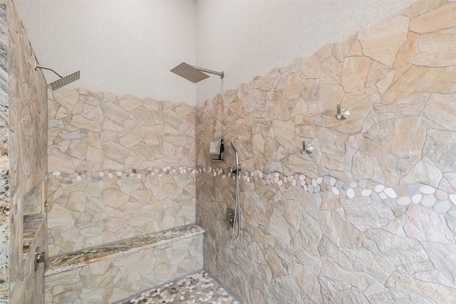 bathroom featuring tiled shower