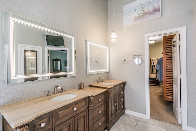 bathroom featuring tile patterned flooring and vanity