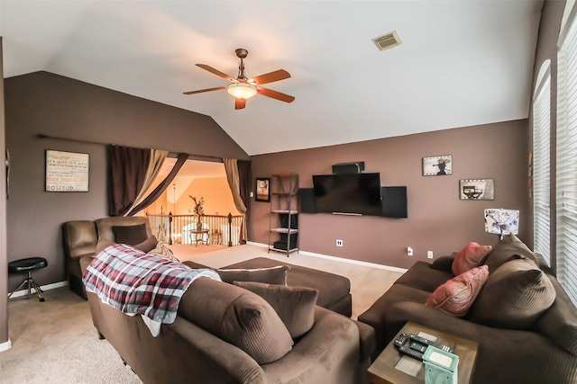 living room with lofted ceiling, carpet flooring, and ceiling fan