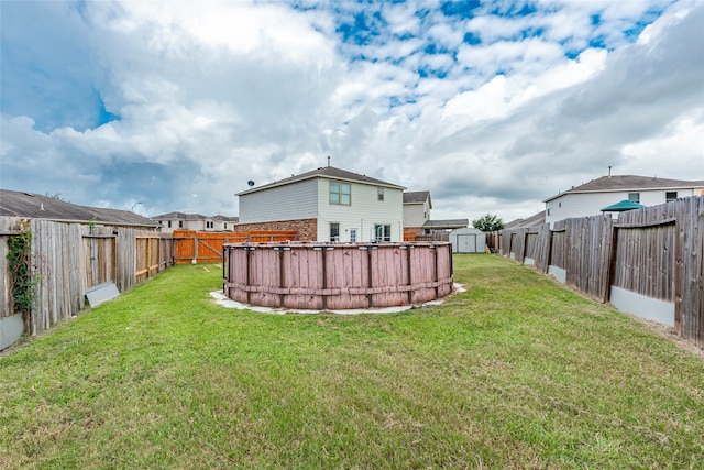 view of yard with a storage shed