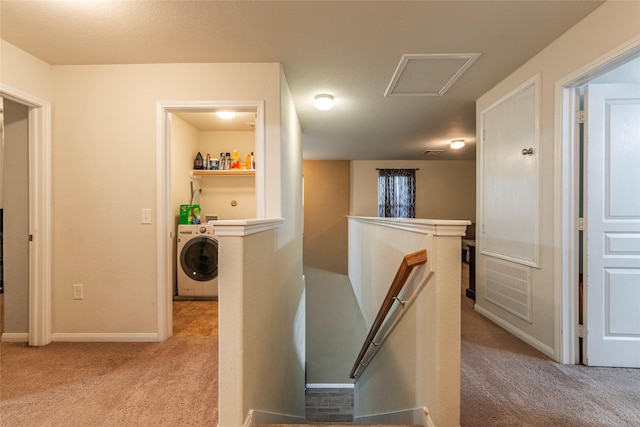 16555 Mandate Dr, Houston, TX 77049 - hall featuring baseboards, an upstairs landing, carpet floors, attic access, and washer / dryer