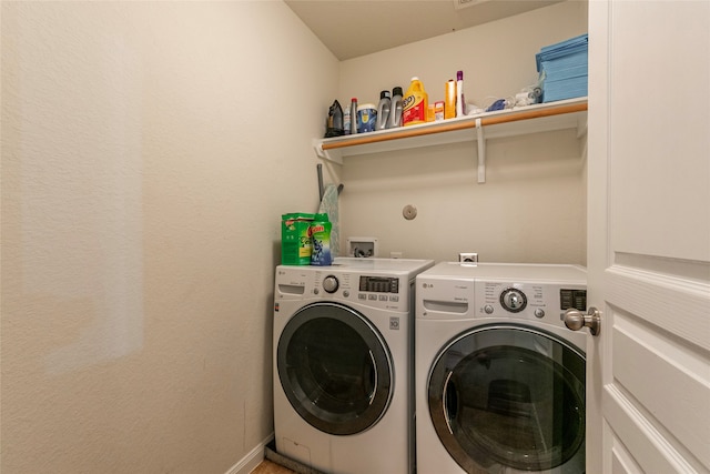 laundry area featuring washing machine and dryer