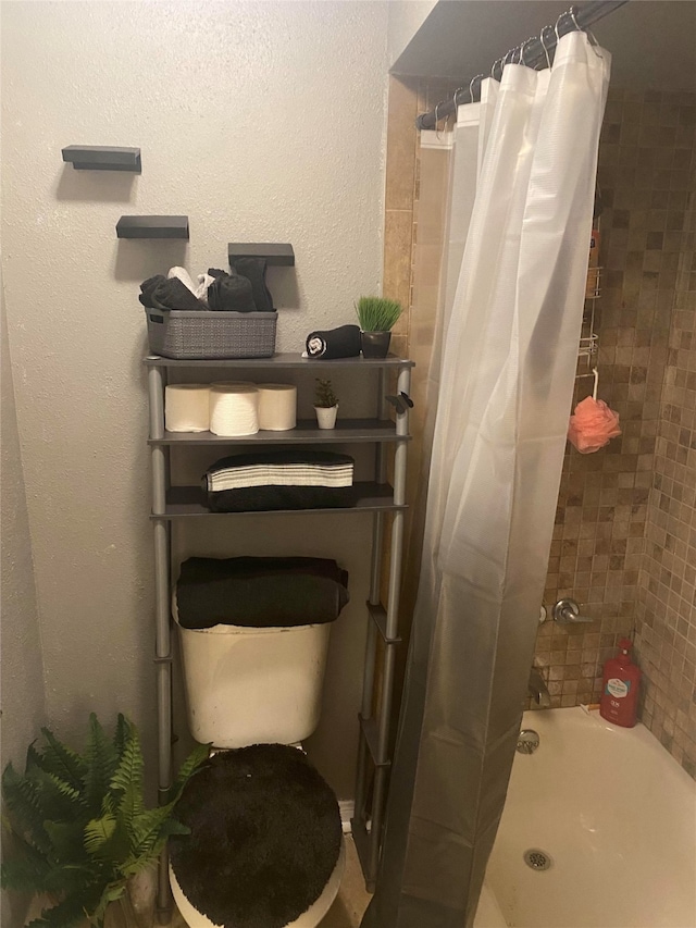 bathroom featuring toilet