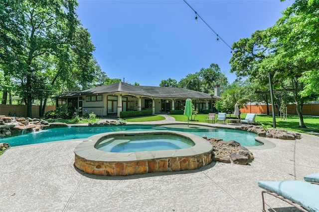 view of pool with a patio and an in ground hot tub