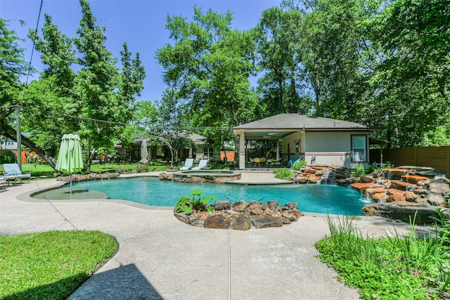 view of pool featuring a patio area and pool water feature