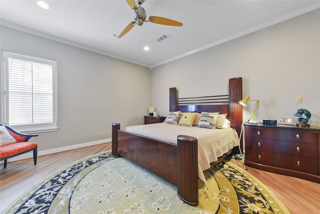 bedroom with crown molding, ceiling fan, and light wood-type flooring