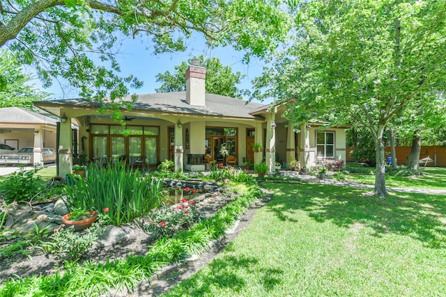 back of house with a yard