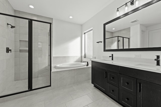 bathroom featuring vanity, tile patterned flooring, and shower with separate bathtub