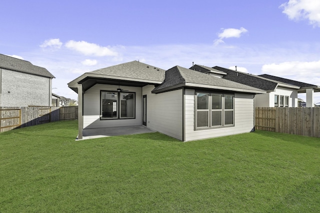 back of house with a yard, ceiling fan, and a patio area